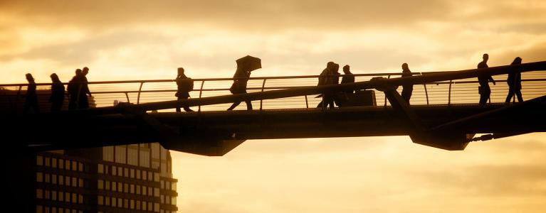 Man with umbrella on Jubilee Bridge