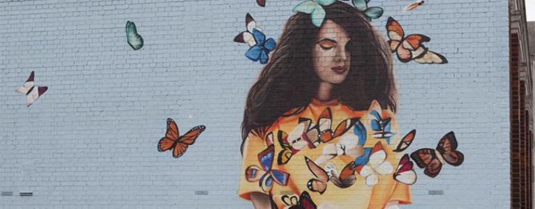 Street art of girl reading book