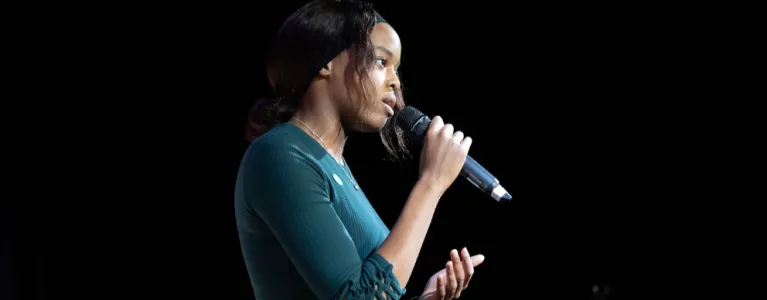 Talking girl holding a microphone