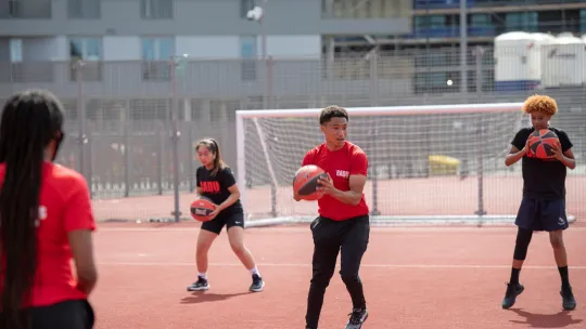 Teenagers playing outdoor sport at Badu Sports