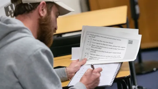 Man completing a test at Sutton College