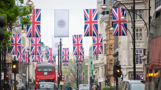 A major London high street dressed in Union Jacks and Coronation flags.