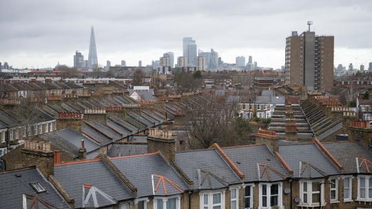 Photo of roofs in Peckham with London skyline in background