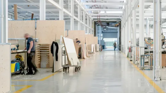 Inside a large industrial warehouse/shed for woodworking