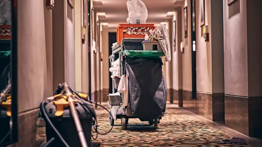 a cleaning trolley in a hotel hallway