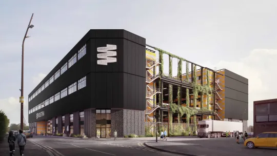 Street view of Industria, industrial workspace showing green "living" wall