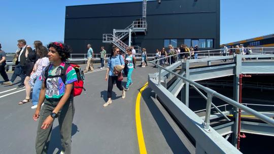 Rendered image of people on vehicular ramp