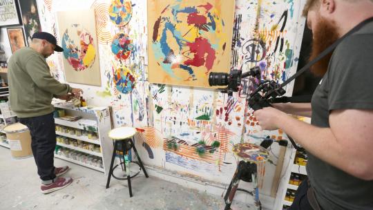 Artist in their studio being filmed in the Acton and Park Royal Creative Enterprise Zone 