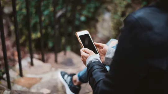 A woman texting on a mobile phone 