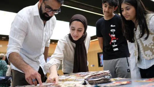 Young people at a steering group, with heritage experts, sharing ideas for the partition remembered project