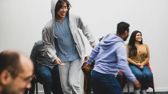 Micro Rainbow theatre lab participants act out what makes a good community