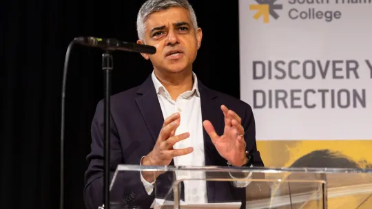 The Mayor giving a speech at a lectern at an indoor launch event