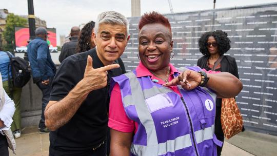 Mayor stood smiling with volunteer 