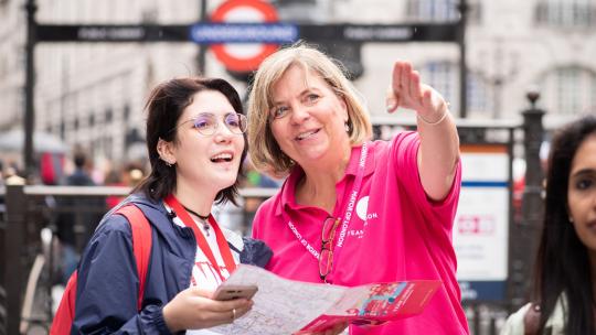 Volunteer helping member of the public
