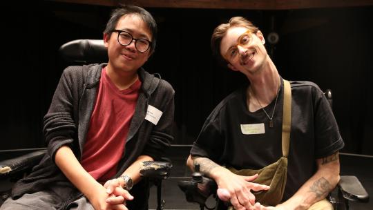 James Lee (left) and Jordan Whitewood-Neal (right) pictured together smiling on stage. 