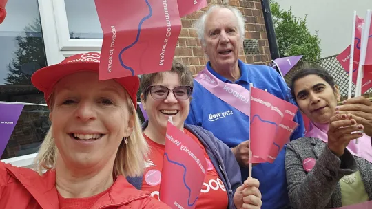Group of Goodgym volunteers with MCW 2025 flags