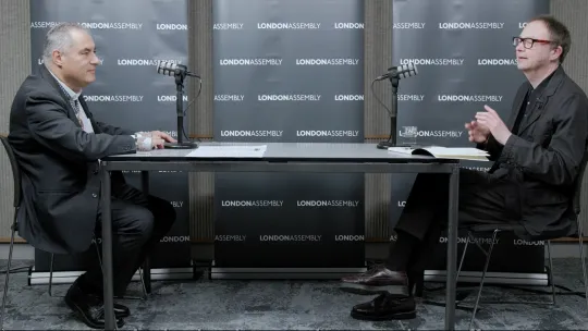 Two men speaking with mics