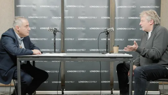 two men talking into mics