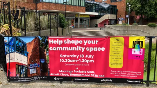 Peabody Community Trust Moorings Social Club banner on railing promoting a Loved and Wanted community event