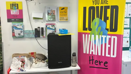 Rainham Foodbank inside entrance with a large Loved and Wanted banner display