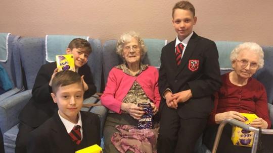 Boys from Abbotsfield School with residents of a care home
