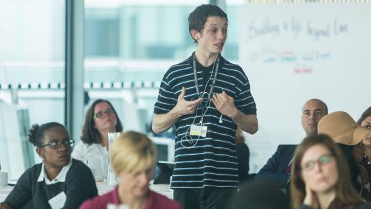 Young person speaking at meeting