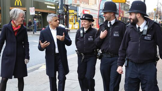 Mayor Sadiq Khan walks with Deputy Mayor Sophie Linden and police constables