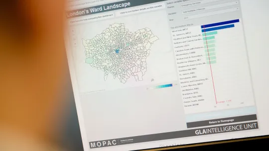 A person looking at data on a computer screen
