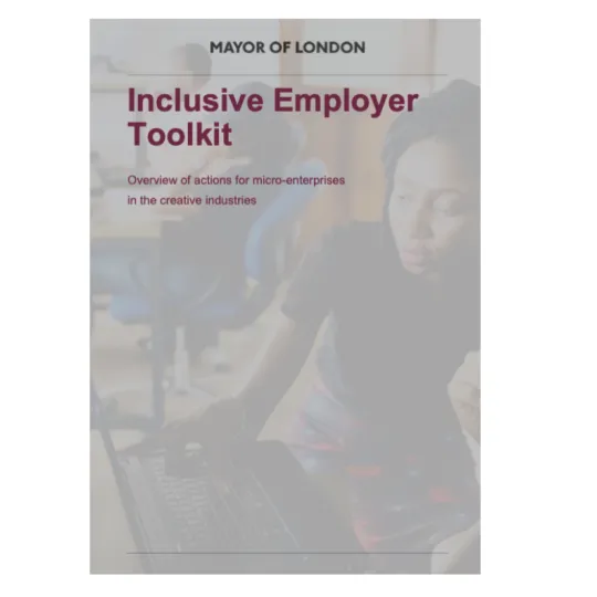 The front cover of the inclusive employer toolkit, showing a photo of a woman on a computer