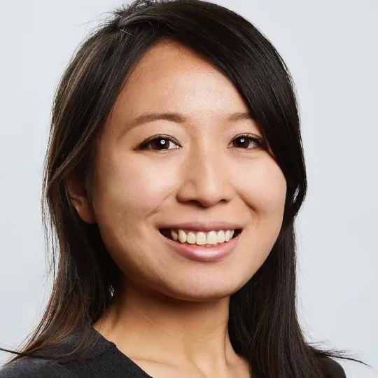 Portrait of Yoyu Li, who smiles brightly at the camera