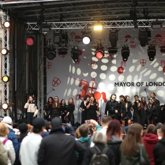 People standing around a stage