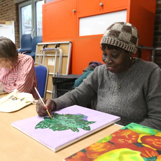 person working on artwork 