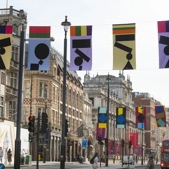 Art flags on display hung above oxford street in London