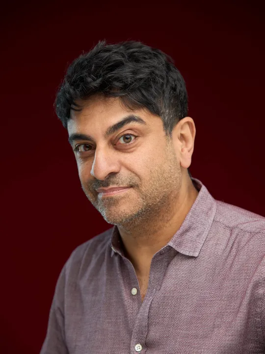 Photo of Ash Kotak looking towards the camera