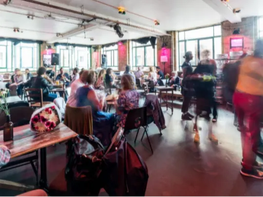 A bar with blurry people