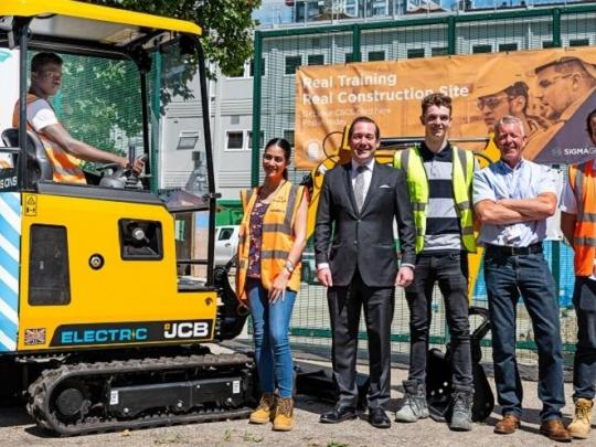 JCB and Southwark Construction Skills Centre employees posing for picture