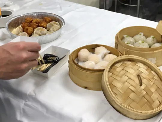 Eating dumplings during OPDC site tour