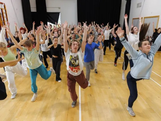 MassDance group of people performing a dance move