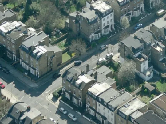 Aerial photograph of a terraced street with an infill site outlined in red