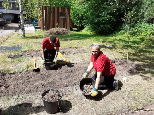 Two people gardening