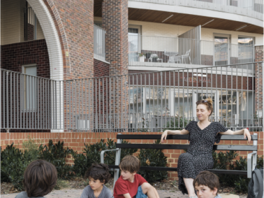 Supervised children eating in a public area in a new development