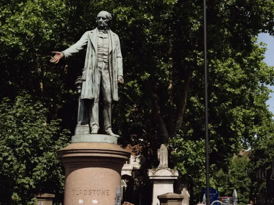 A family look at the Gladstone statue in Bow, East London