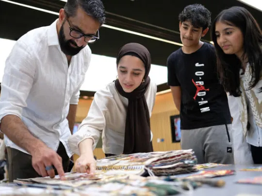 Young people at a steering group, with heritage experts, sharing ideas for the partition remembered project