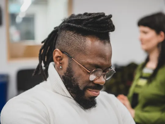 Micro Rainbow theatre lab participants close eyes to imagine a perfect community