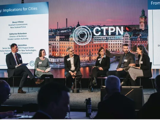 Group of panelists on CTPN conference stage.