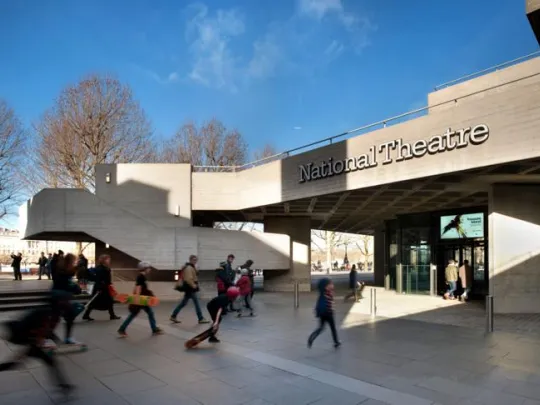 The exterior of the National Theatre on the South Bank – a concrete building in the Brutalist style, with interconnected terraces.