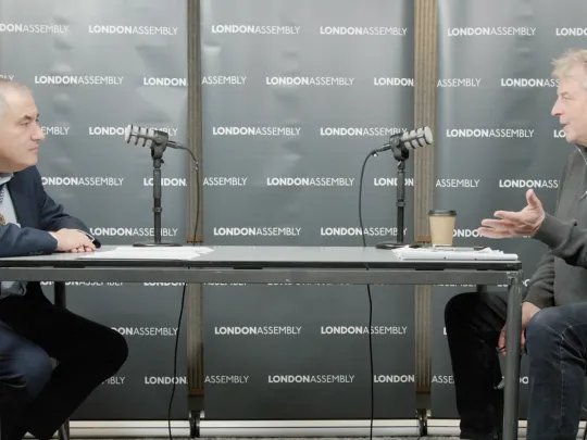 two men talking into mics