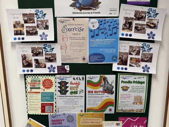 A vibrant community noticeboard at Balham Library showcasing a wide range of dementia friendly activities, cultural groups, and local support services.