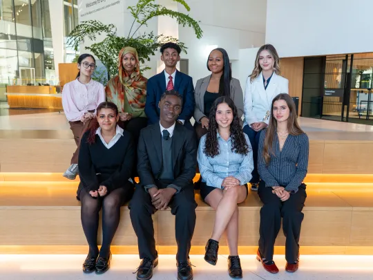9 young people dressed formally