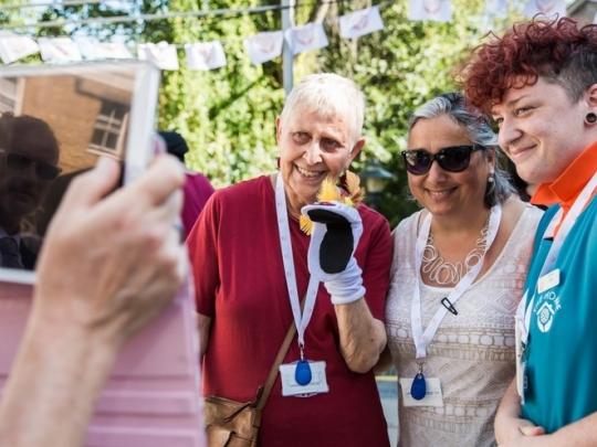 Three women posing for picture at a Garden Party